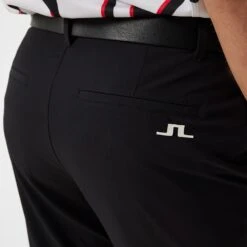 J.Lindeberg Golf Trousers - Cuff Jogger Pant - Black AW23 -Golf Fashion Shop j lindeberg golf joggers performance cuffed pant black ss23 gmpa08622 9999 32