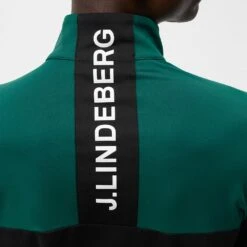 J.Lindeberg Golf Mid Layer - Banks FZ - Rain Forest AW23 -Golf Fashion Shop j lindeberg golf mid layer banks fz rain forest aw23 amjs09082 m374 77