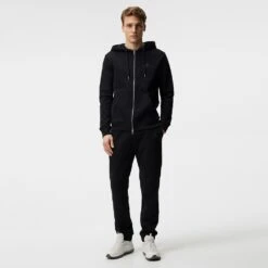 J.Lindeberg Golf Hoodie - Alpha Fleece FZ - Black SS23 -Golf Fashion Shop j lindeberg golf pullover alpha zip hood black ss23 amjs07674 9999 p
