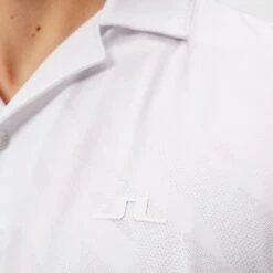 J.Lindeberg Golf Shirt - Resort Relaxed Fit - White HS23 -Golf Fashion Shop j lindeberg golf shirt resort relaxed fit white hs23 gmjt08406 0000 a