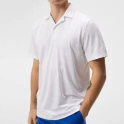 J.Lindeberg Golf Shirt - Resort Relaxed Fit - White HS23 -Golf Fashion Shop j lindeberg golf shirt resort relaxed fit white hs23 gmjt08406 0000 b