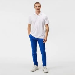 J.Lindeberg Golf Shirt - Resort Relaxed Fit - White HS23 -Golf Fashion Shop j lindeberg golf shirt resort relaxed fit white hs23 gmjt08406 0000 c