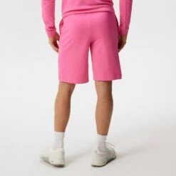 J.Lindeberg Golf Shorts - Jersey Logo - Azalea Pink HS23 -Golf Fashion Shop j lindeberg golf shorts jersey logo azalea pink hs23 gmjs08398 s098 d