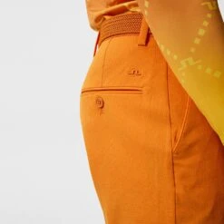 J.Lindeberg Golf Shorts - Vent Tight Fit - Russet Orange SS23 -Golf Fashion Shop j lindeberg golf shorts vent tight shorts russet orange ss23 gmpa07908 i068 c