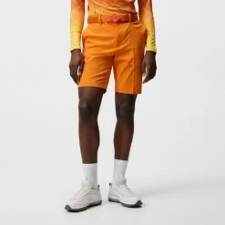 J.Lindeberg Golf Shorts - Vent Tight Fit - Russet Orange SS23 -Golf Fashion Shop j lindeberg golf shorts vent tight shorts russet orange ss23 gmpa07908 i068 e