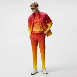 J.Lindeberg Golf Trousers - Fade Print Pant Slim - Sunset SS23 -Golf Fashion Shop j lindeberg golf trousers fade print pant sunset fade logo ss23 gmpa08235 i174 d