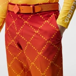 J.Lindeberg Golf Trousers - Fade Print Pant Slim - Sunset SS23 -Golf Fashion Shop j lindeberg golf trousers fade print pant sunset fade logo ss23 gmpa08235 i174 e