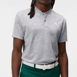 J.Lindeberg Golf Shirt - Bode Regular Fit - Grey Mel. AW23 -Golf Fashion Shop j lindeberg golf shirt bode regular fit grey mel aw23 gmjt08578 9363 65