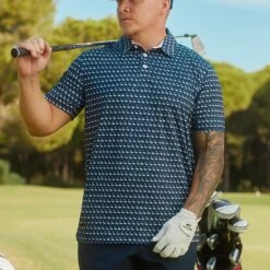 PUMA Golf Shirt - MATTR Flamingo Tile Polo - Navy Blazer SS23 -Golf Fashion Shop puma golf shirt mattr flamingo tile polo navy blazer ss23 537458 01 x